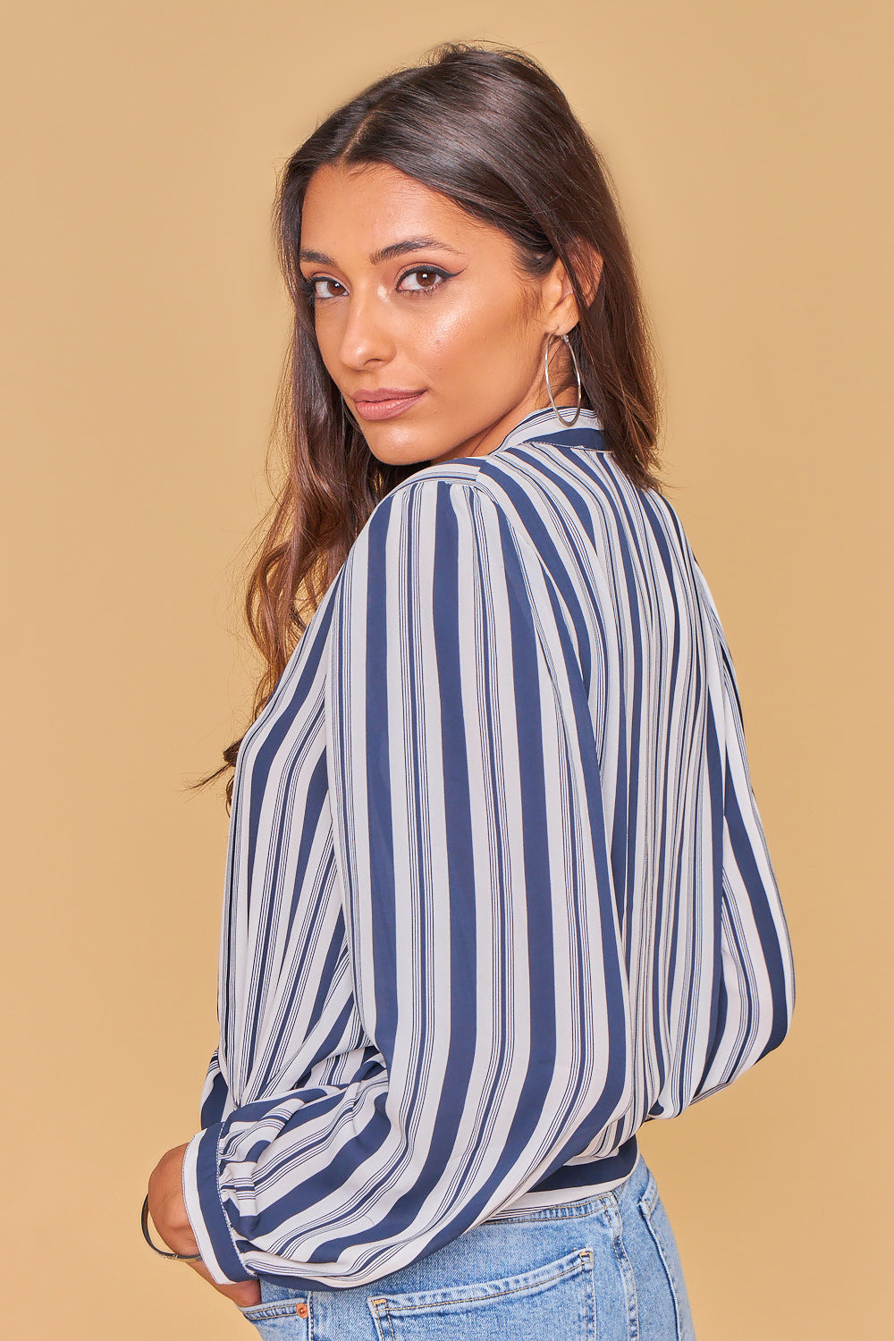 Blue and white striped knotted shirt.