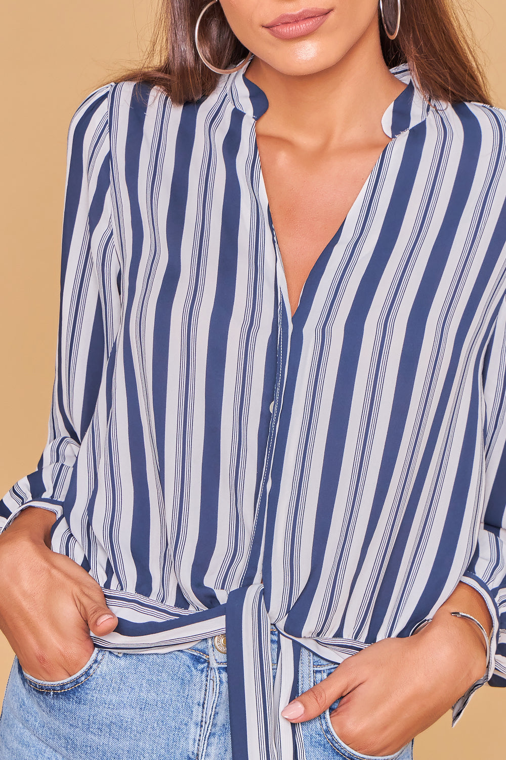Blue and white striped knotted shirt.