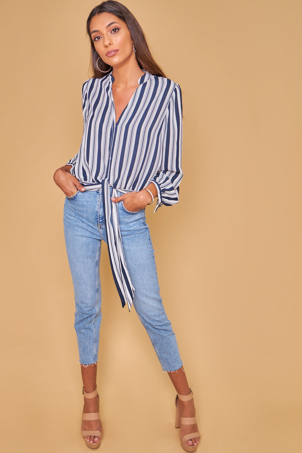 Blue and white striped knotted shirt.