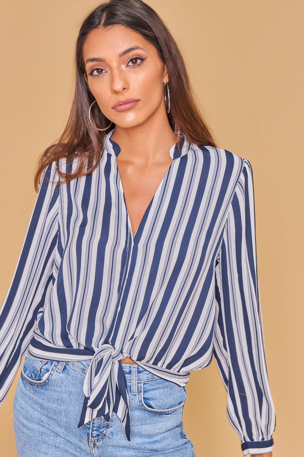 Blue and white striped knotted shirt.